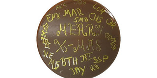 Merry X-Mas made of E.coli cells on an agar plate