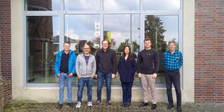 The participants of the excursion in front of the distillery